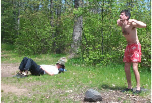 Allen doing the chicken dance while Ron sleeps - 2003